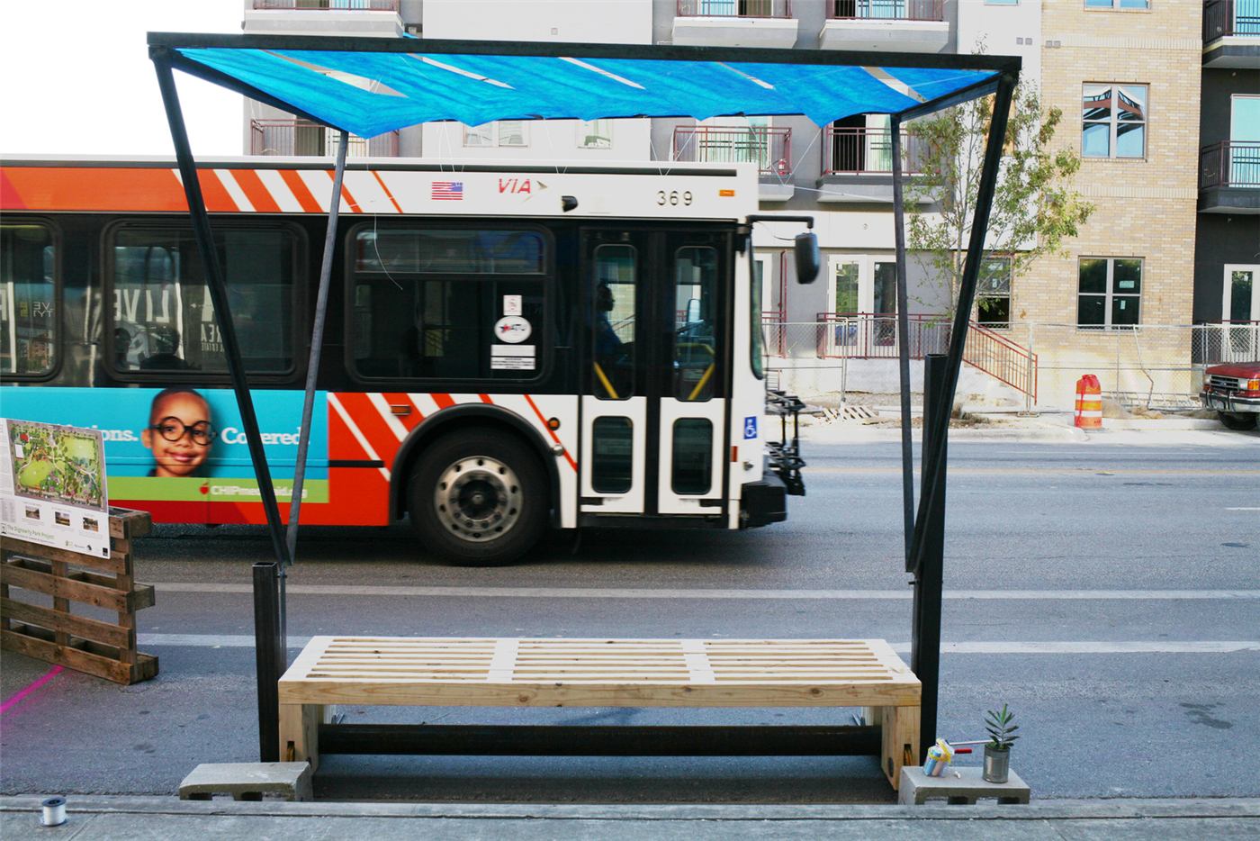 Bus Bench — prototype bench and pivoting fabric canopy in the sun