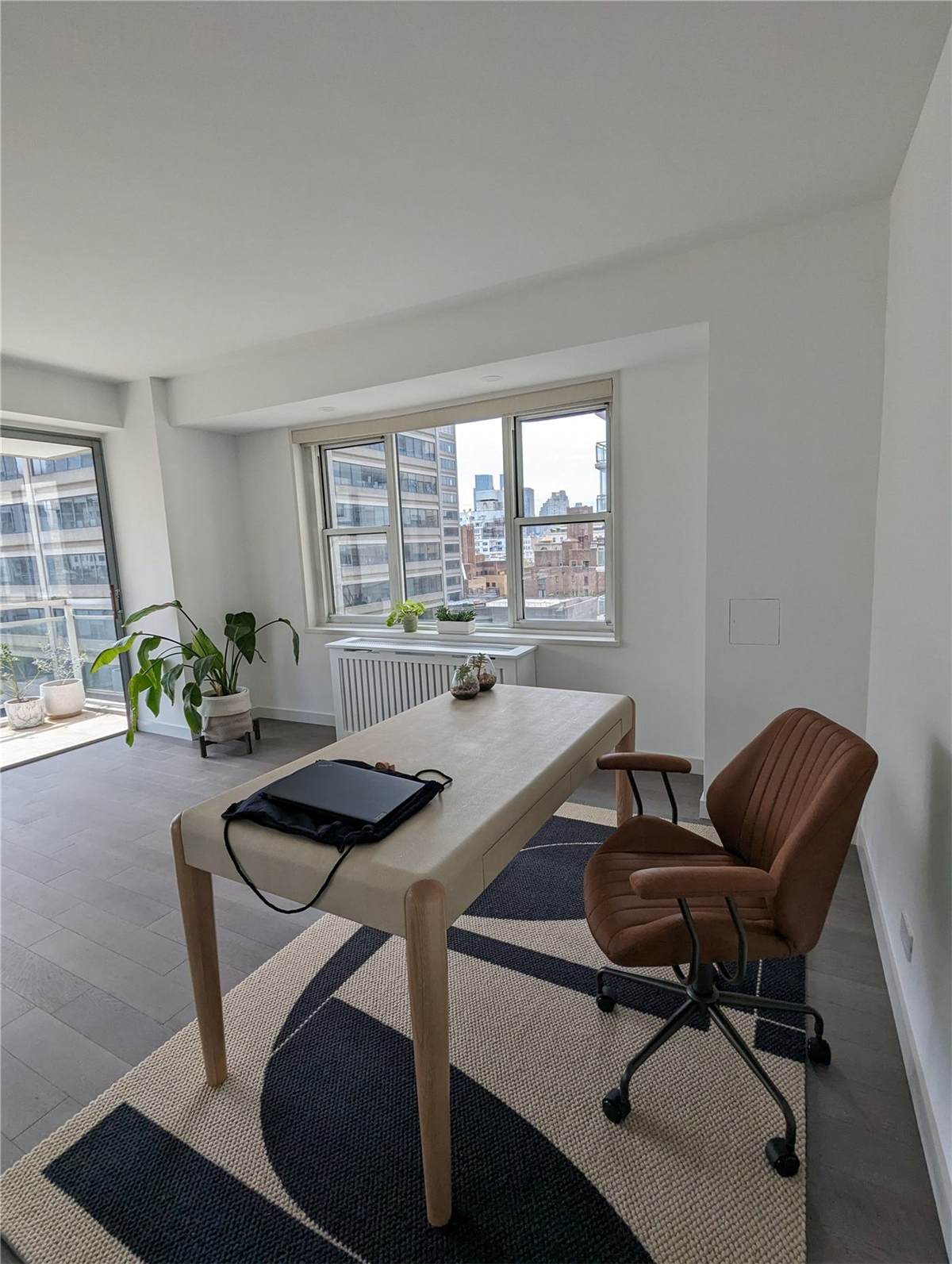 Condo No. 1 — former second kitchen converted into a marble-countered laundry area