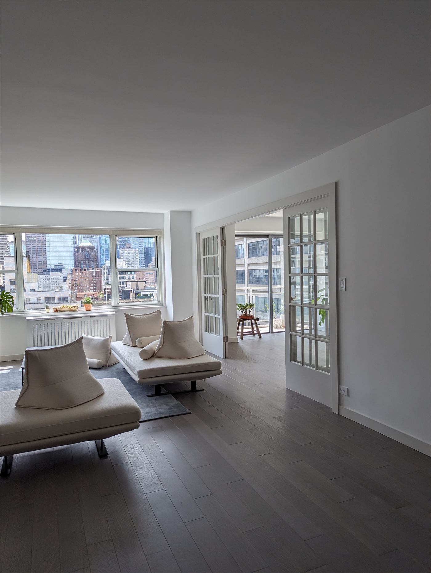 Condo No. 1 — new French door set into the concrete wall between units
