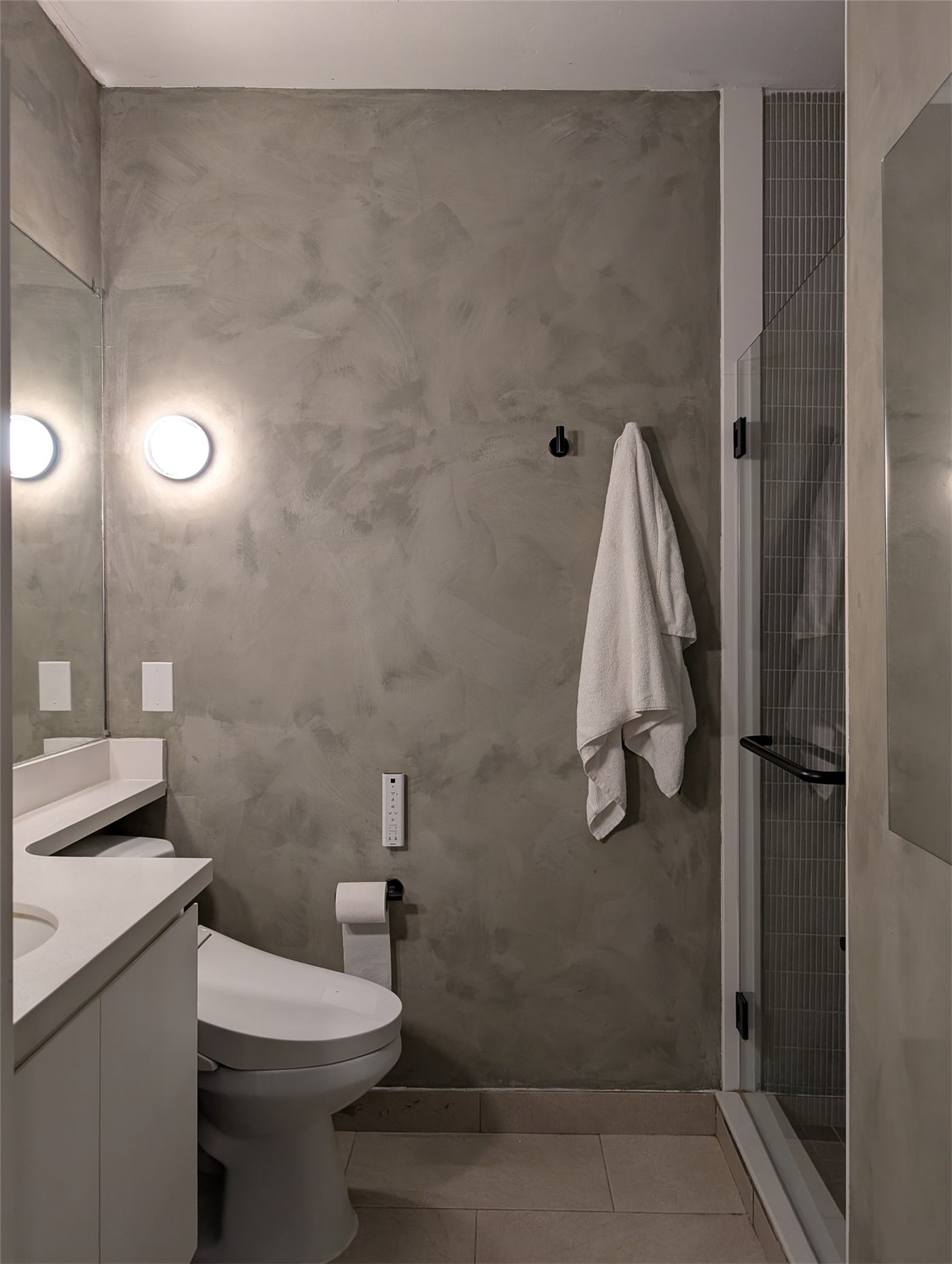 Bathroom No. 2 — vanity counter extending over the toilet tank