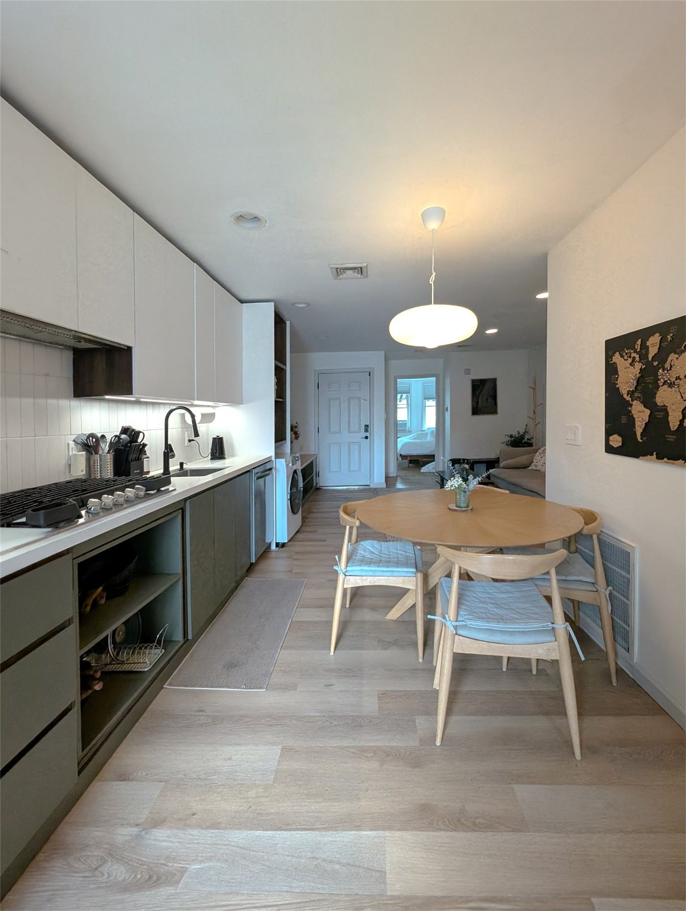 Kitchen No. 1 — integrated dishwasher and laundry concealed in millwork